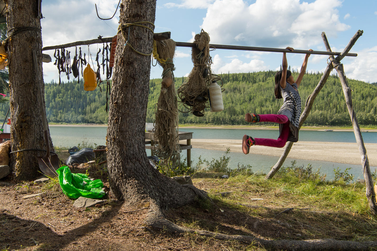 Child swinging near water