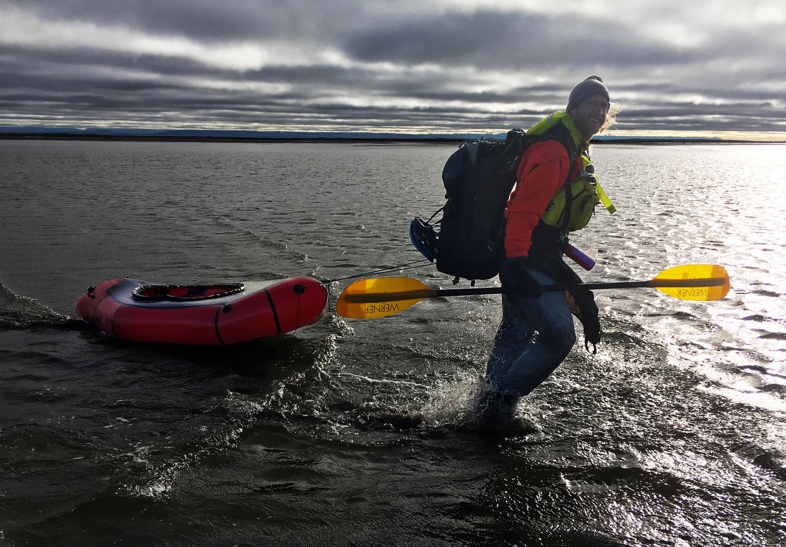 Ben wading through Arey Lagoon on the Arctic Ocean, pickup location in sight!