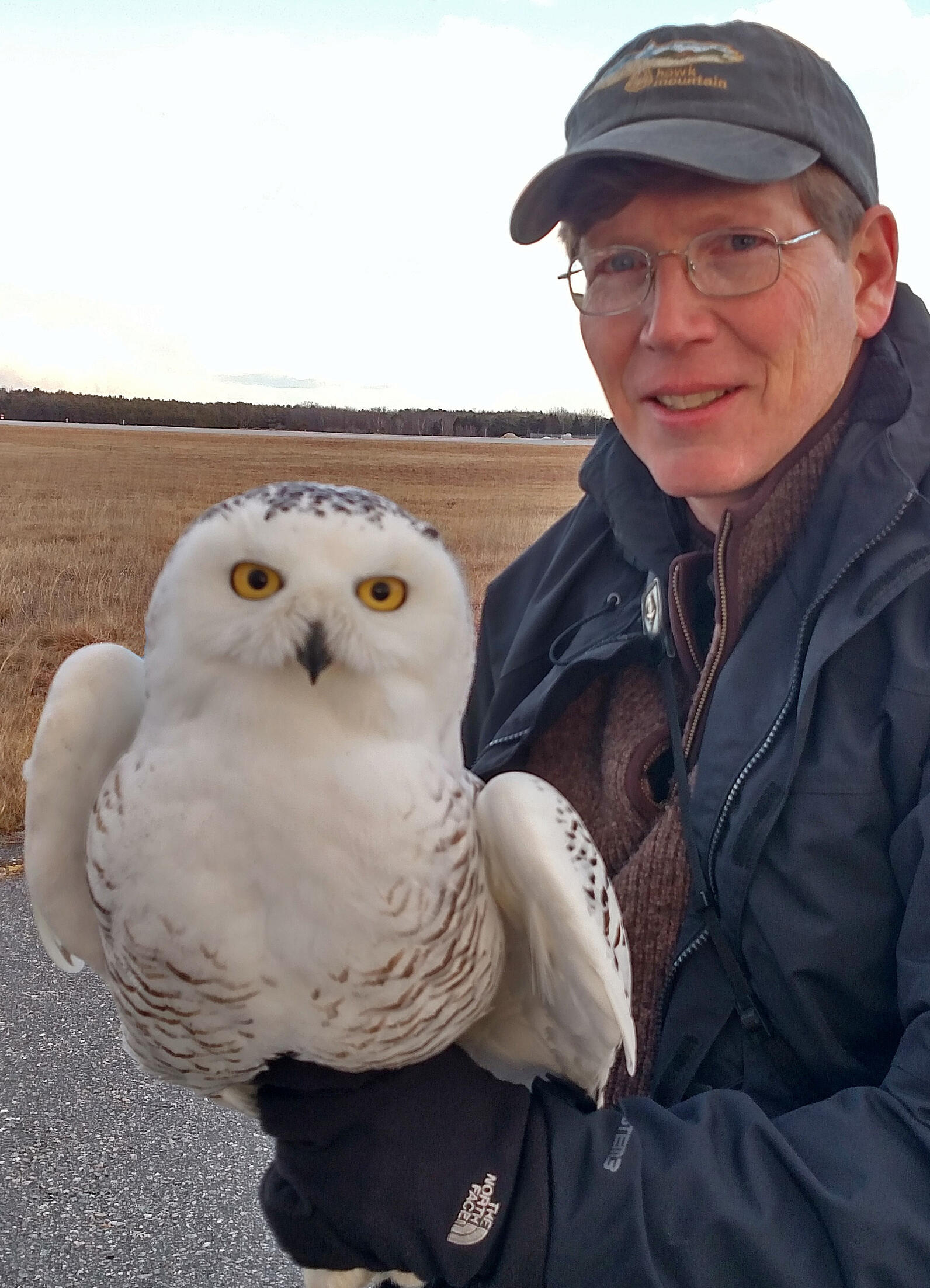 Man holding white owl