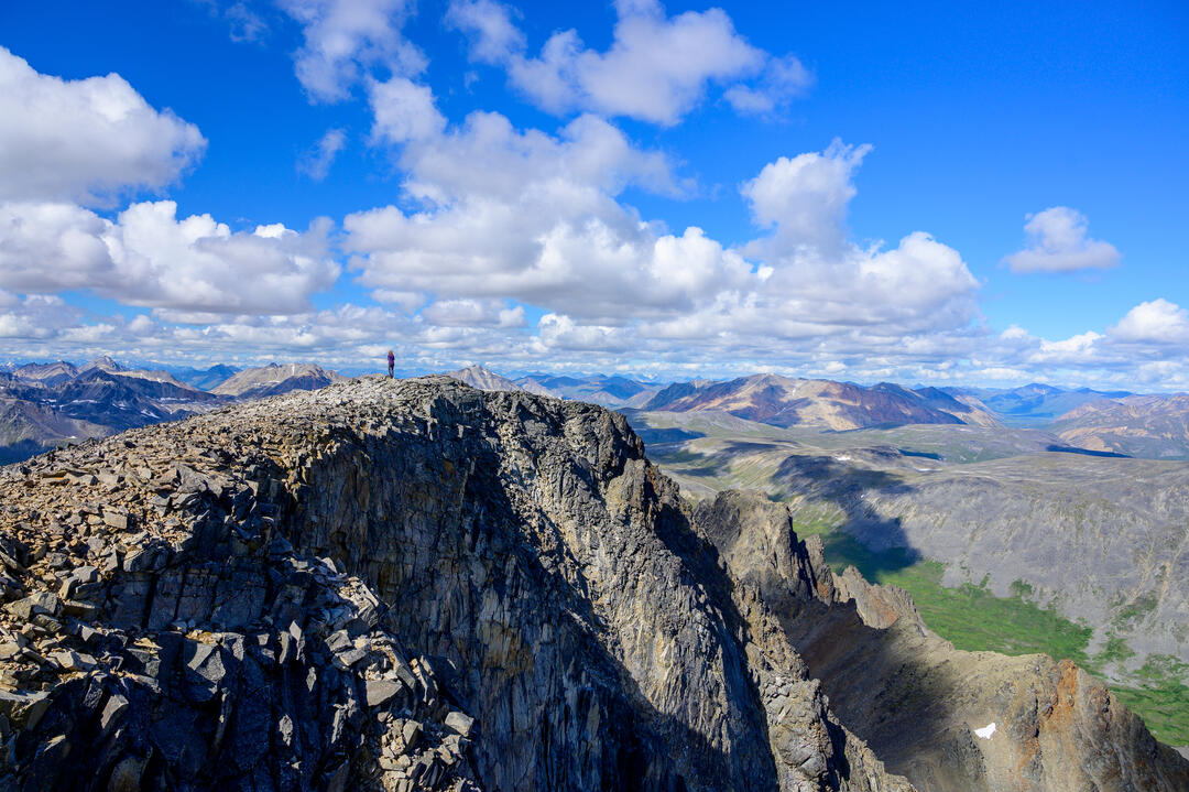 Human standing in mountain range